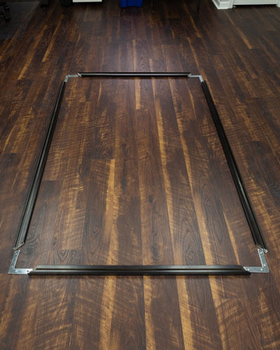 The pieces of a wall art frame used to demonstrate some of the pros and cons of framed wall art