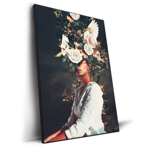 This surreal composition shows a balance between a woman in a white dress and flowers and birds near her head.