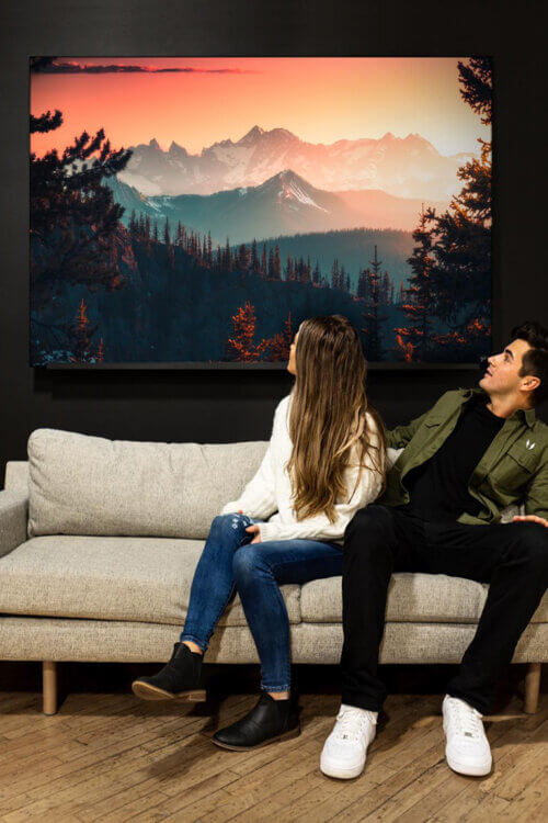 Beautiful mountain sunset photography featured in extra large artwork in living room