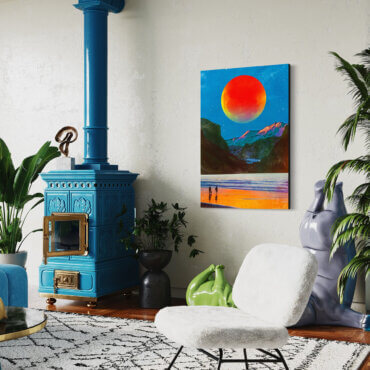 Large contemporary wall art in red, blue, and orange hangs next to blue pellet stove in cozy boho living room.