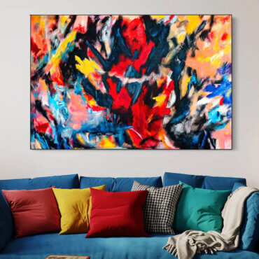 Bold and vibrant colored painting hangs above blue couch in living room.