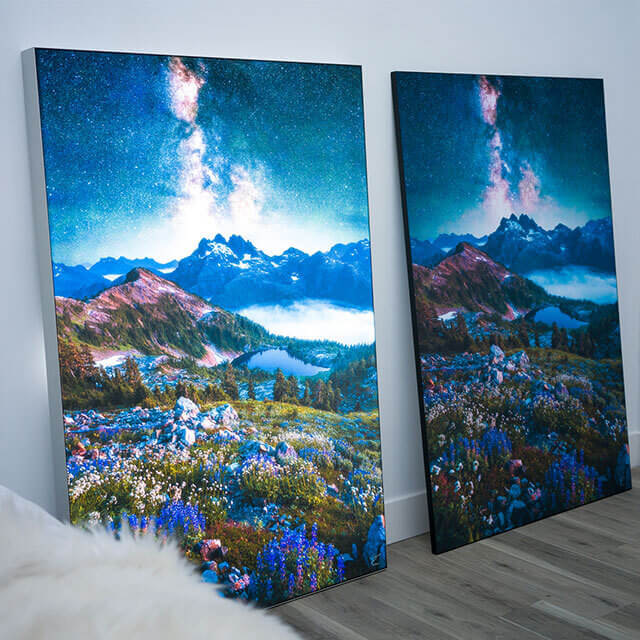 Identical nature photos are displayed side by side in a bedroom. The left image is backlit with a Lightbox. The right image is displayed traditionally on an Infinity Frame.