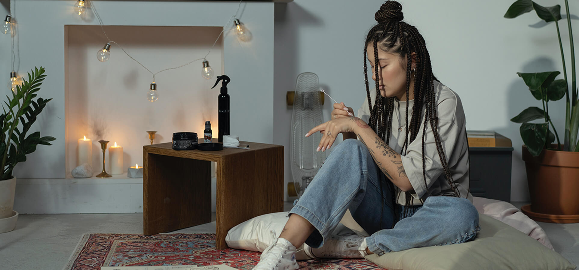 Girl sitting on the floor in boho designed room