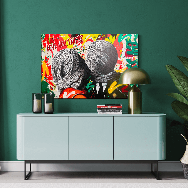 stylish graffiti art on a green wall above a desk