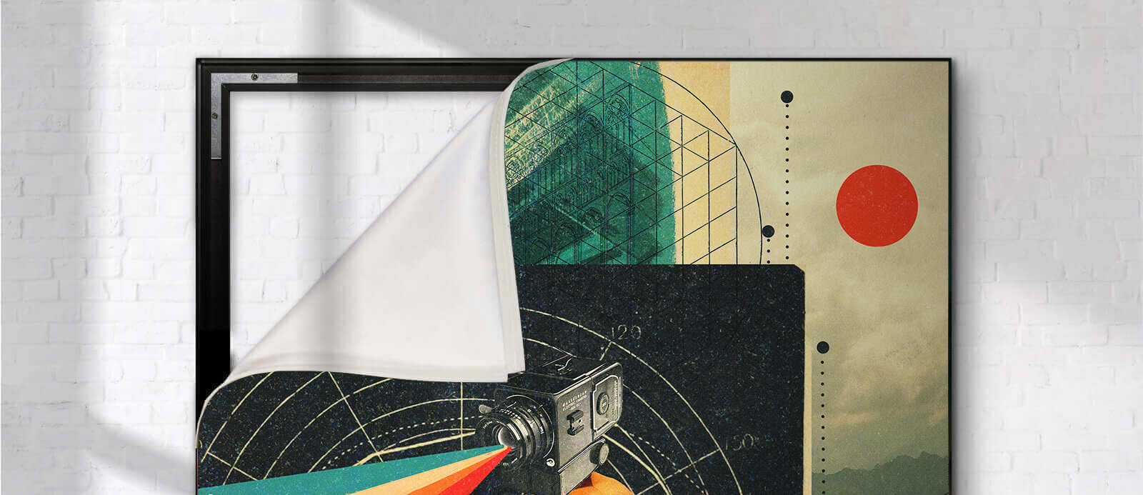 A fabric art print being swapped out of a sleek black frame on a white brick wall.