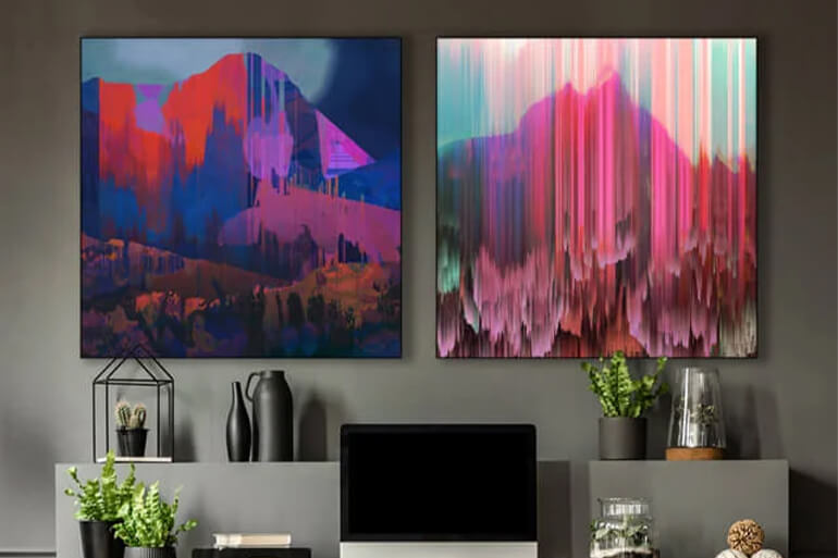 A modern office with two vibrant abstract mountain prints, adding a bold and artistic touch to the workspace.