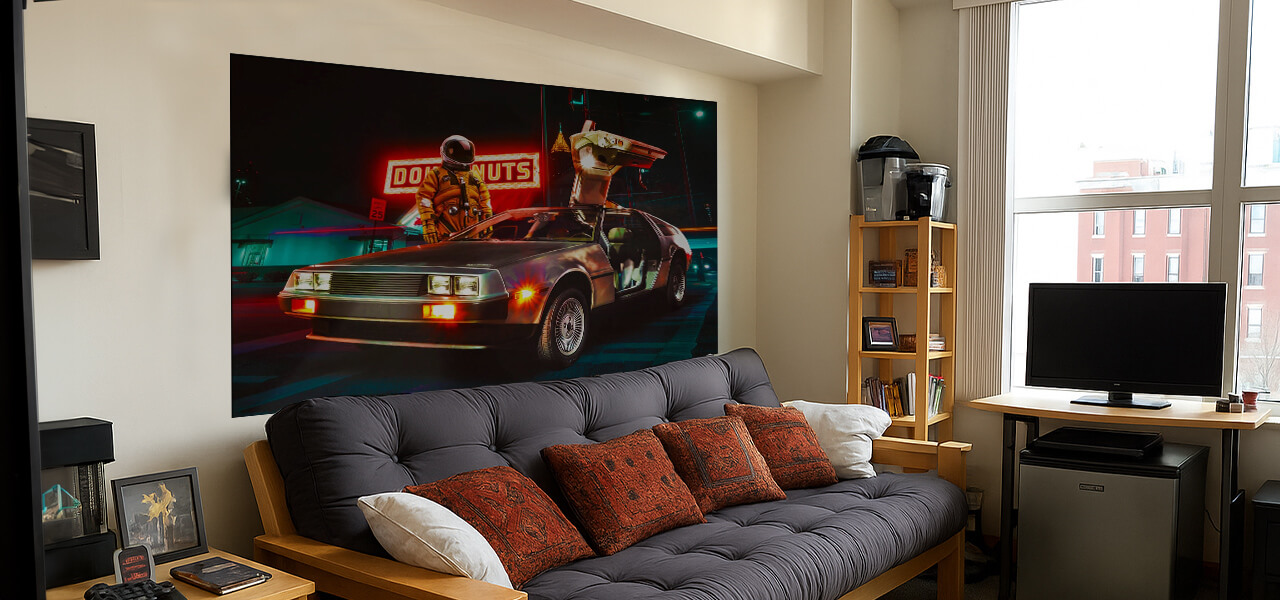 Astronaut wall art print hanging above a futon in a college dorm room
