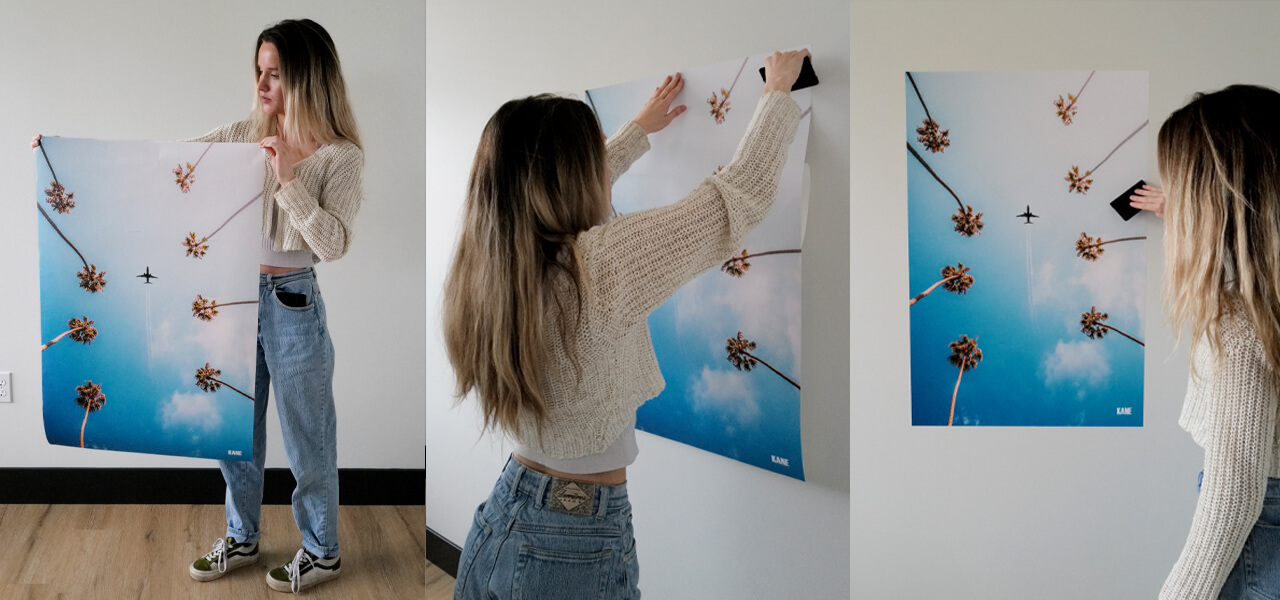 Girl applying a palm tree peel and stick dorm wall art print and the final look on the wall