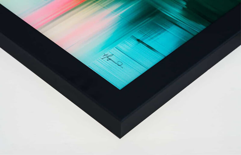 Close-up of a sleek black acrylic frame made from recycled wood.