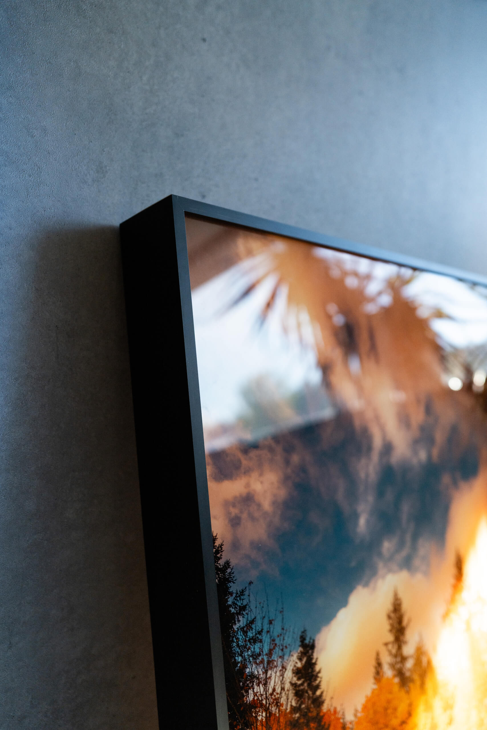 Close-up of D-ring and hanging wire attached to the back of a Bonanza wood frame for acrylic wall art.