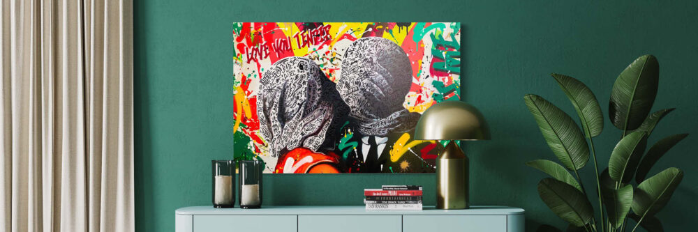 stylish graffiti art on a green wall above a desk