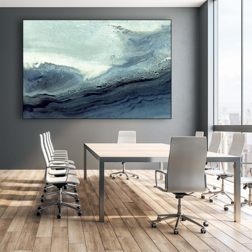 Huge blue abstract wall art of wave hangs on light grey wall in conference room of modern office