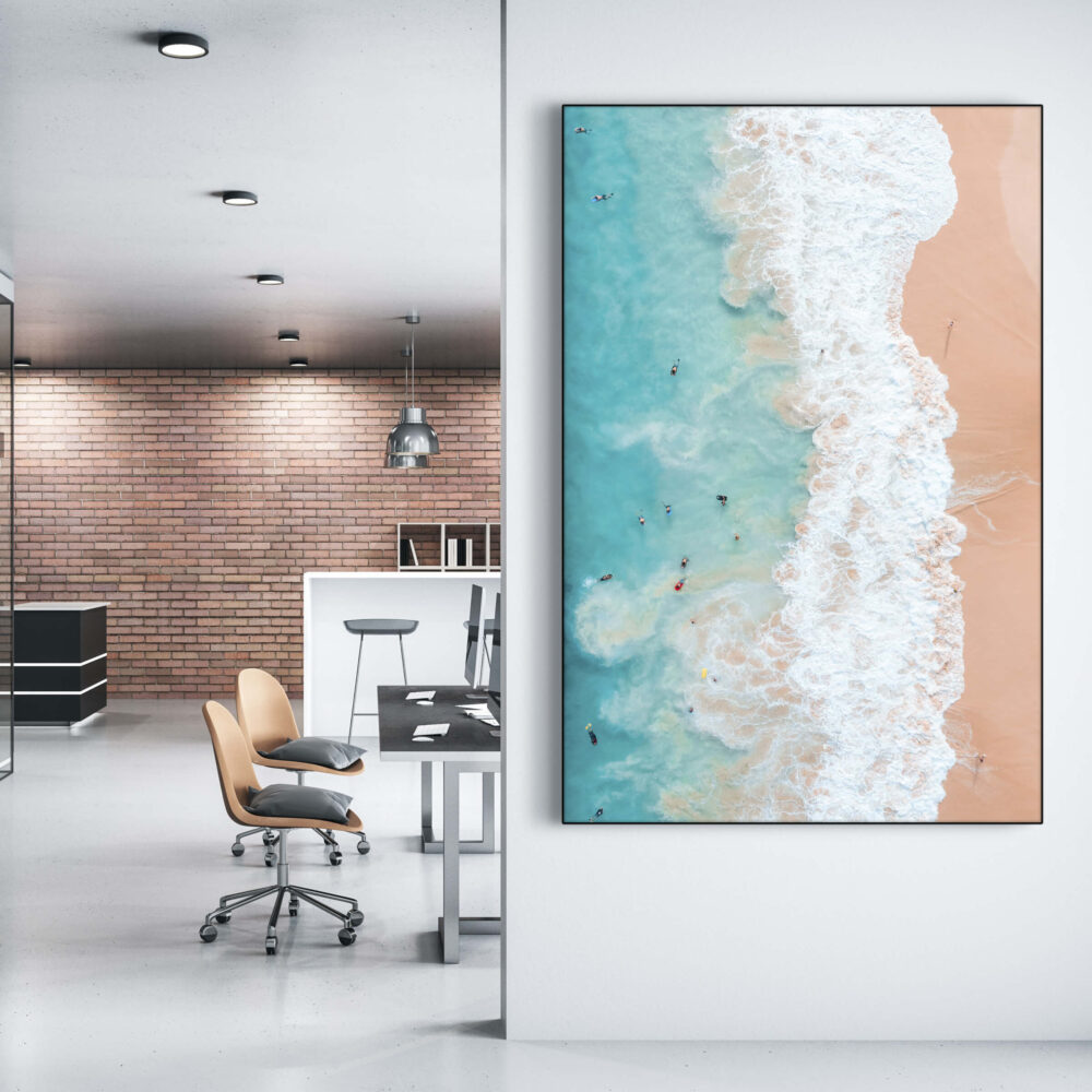 Huge aerial Hawaiian Beach Photo hangs on white wall in modern office