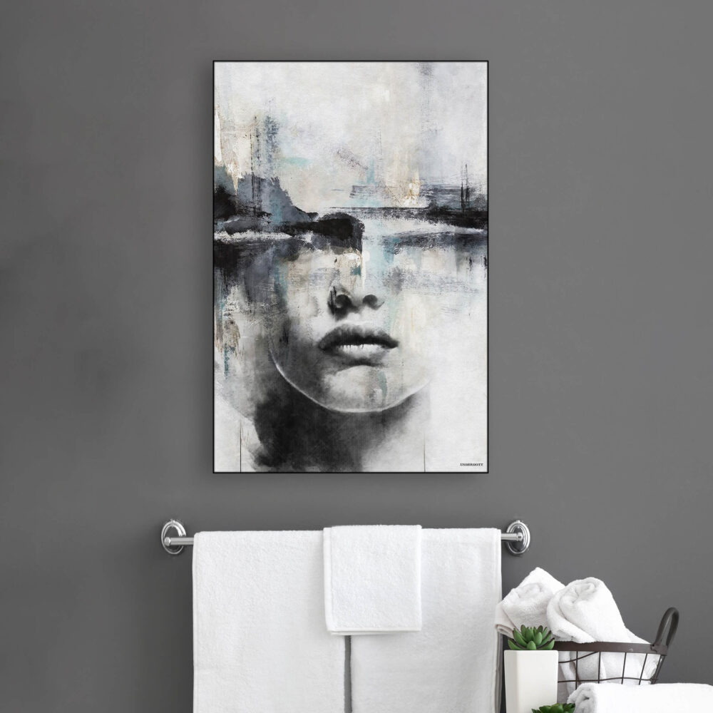 Large abstract face art in neutral grey, black, and blue hangs above towel bar in modern bathroom.
