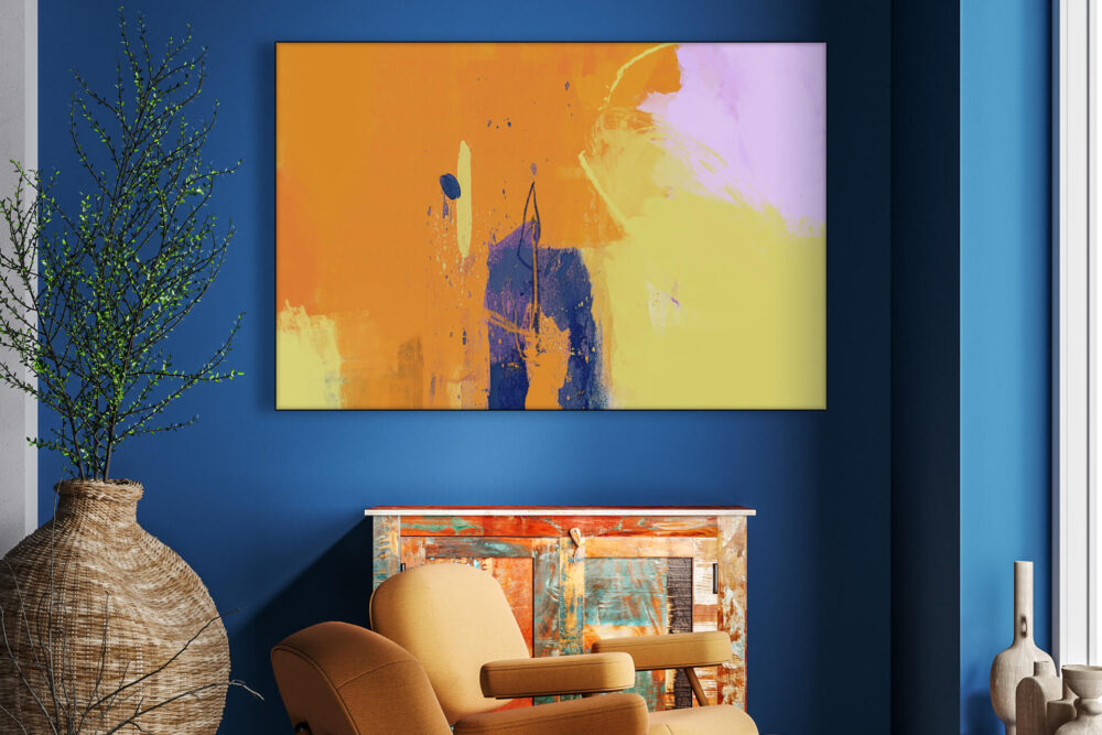 Colorful, bold wall art for an Aries in orange, yellow, light pink, and blue hangs on dark blue wall in living room.