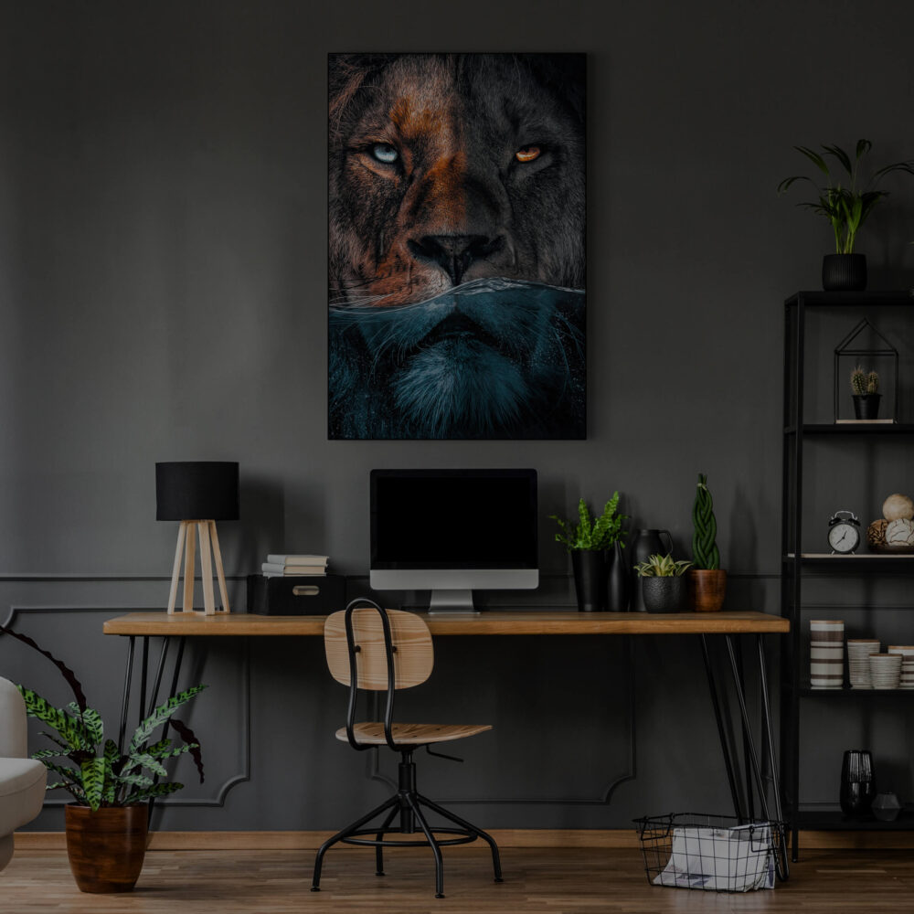 Large lion photo showing lion's face halfway underwater hangs on grey wall in home office.