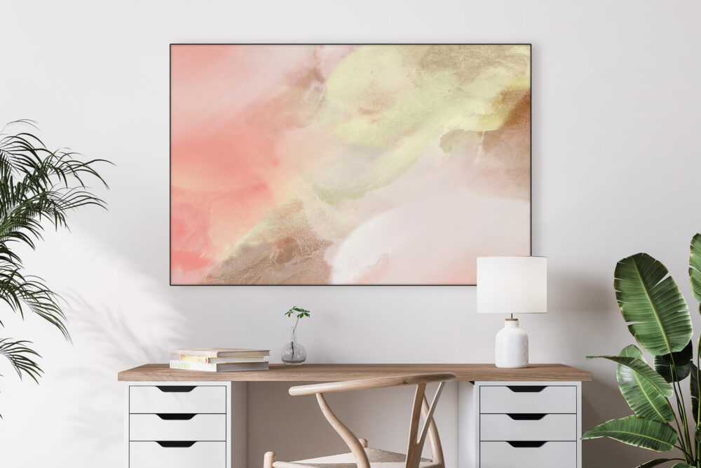 Large horizontal abstract blush pink and neutral painting hangs on white wall in home office above a desk.