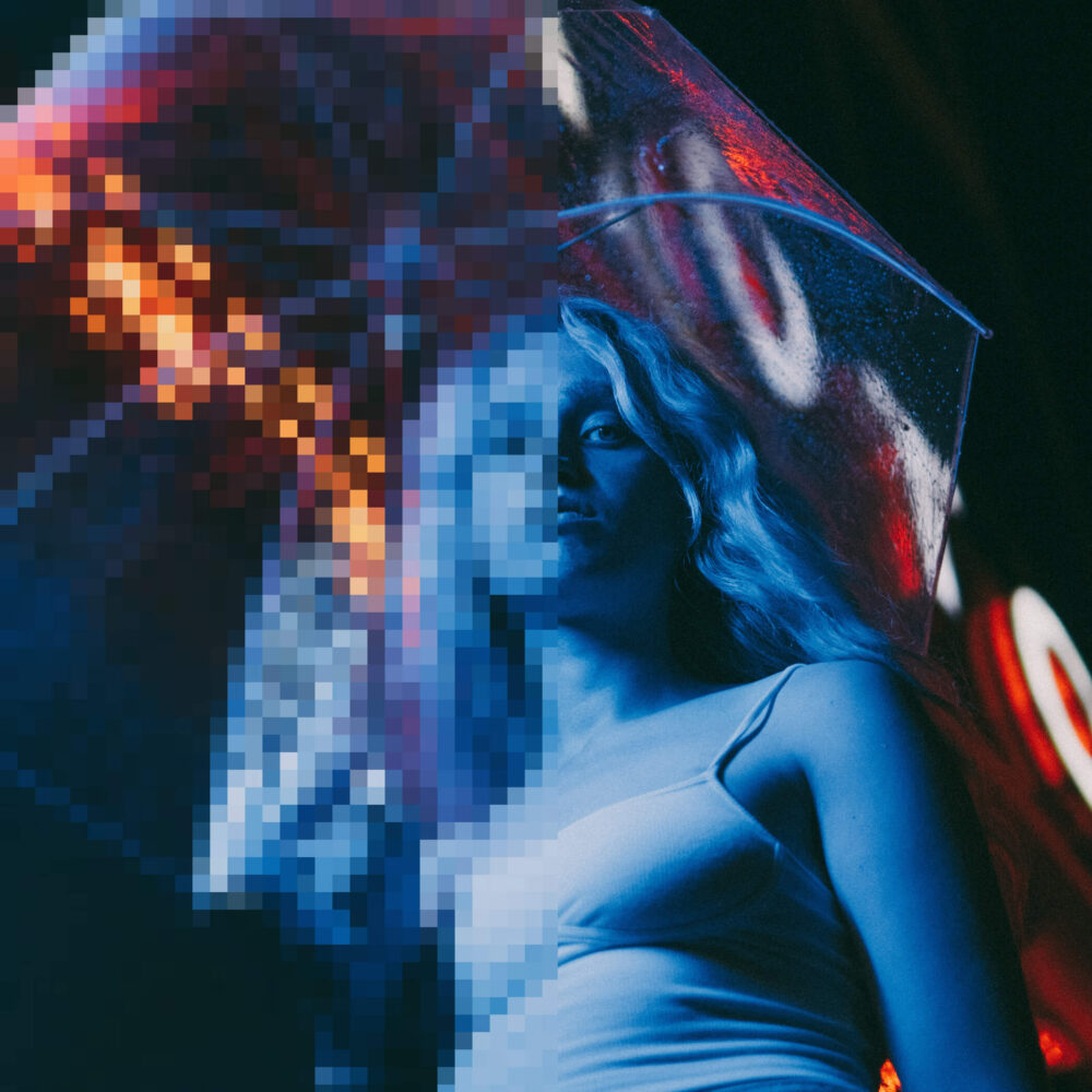 Close up photo of girls face alterted with a blue filter shows before and after pixelated vs clear