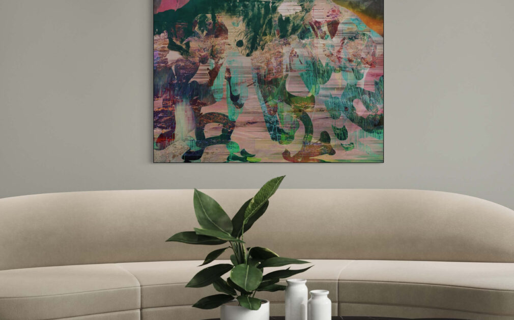 Extra large square abstract artwork in green and gray with pops of yellow and orange hangs above tan sofa in neutral living room