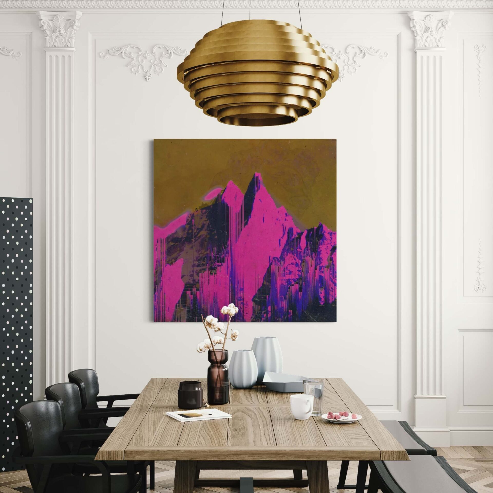 Large pink and gold abstract artwork of mountain hangs in white dining room with gold chandelier