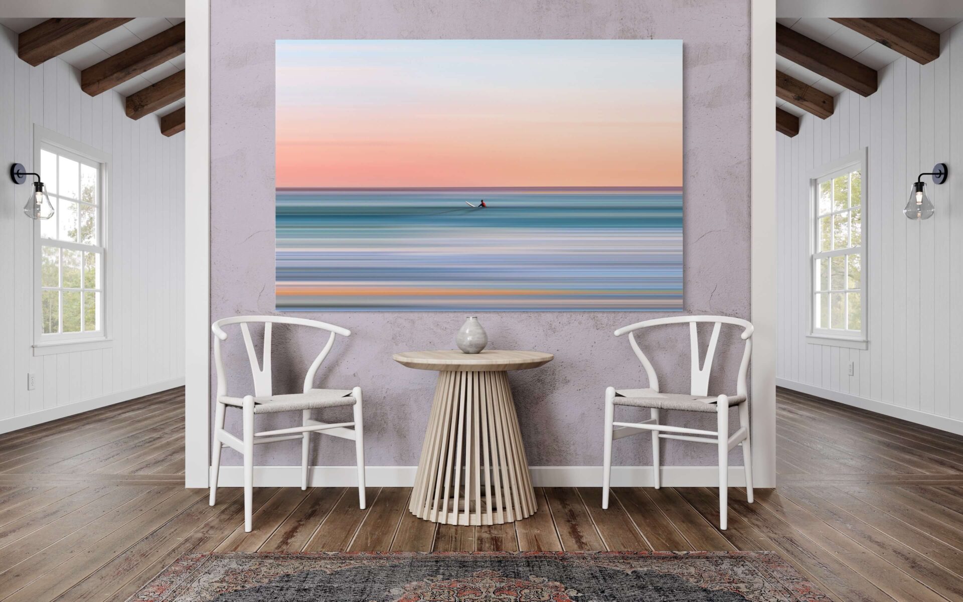 Extra large surreal wave wall art in blue and orange hangs above sitting area in beach house Airbnb