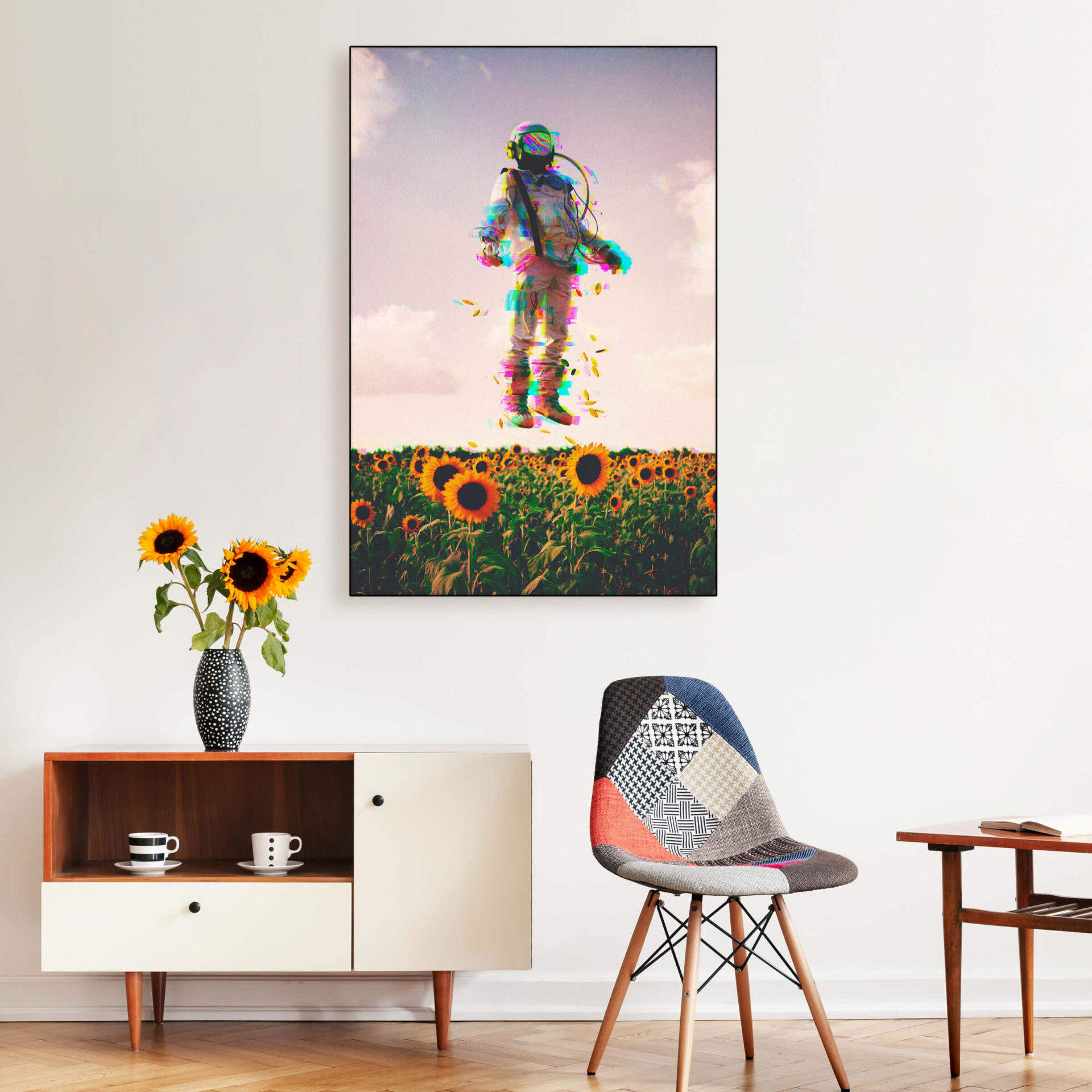 Oversized surreal wall art featuring astronaut floating in sunflower field hangs in entryway