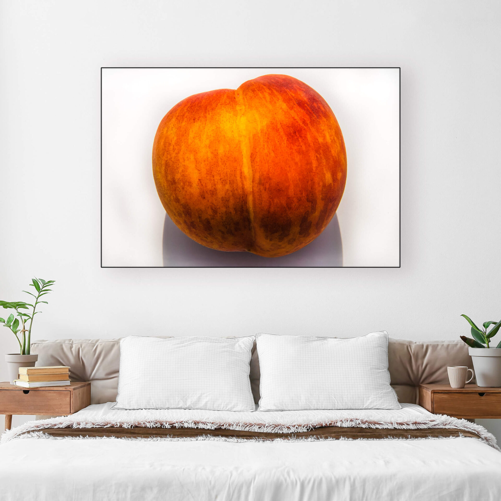 Photo of Peach Hangs Above Bed in White Bedroom