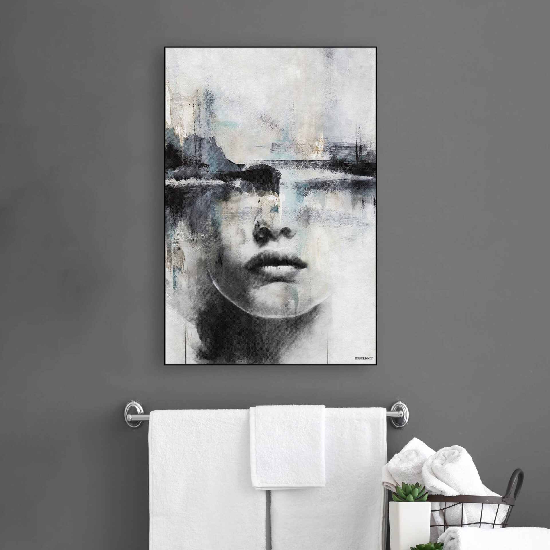 Large abstract face art in neutral grey, black, and blue hangs above towel bar in modern bathroom.