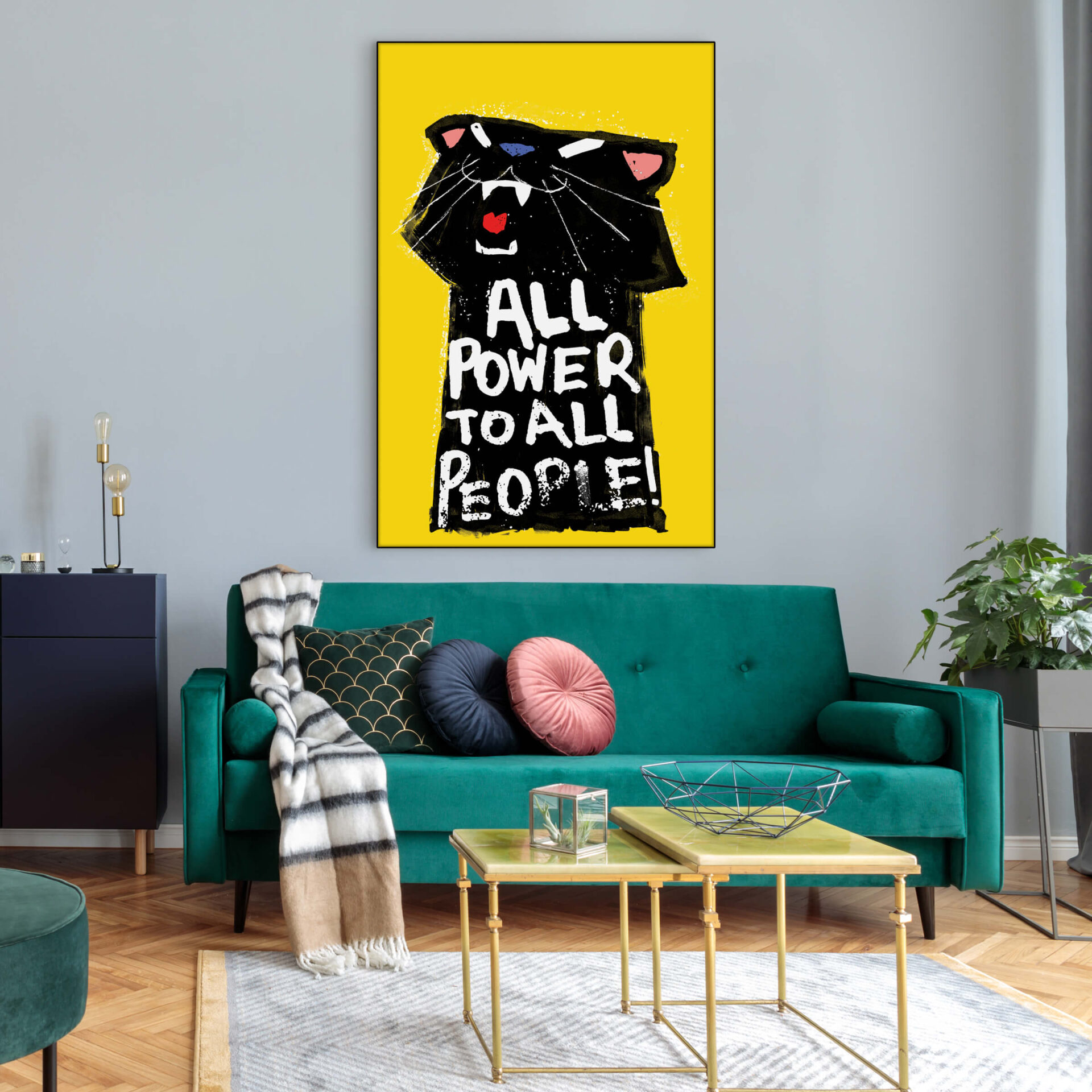 Drawing of a black panther on yellow background with written text All Power to All People hangs on living room wall above teal velvet couch.