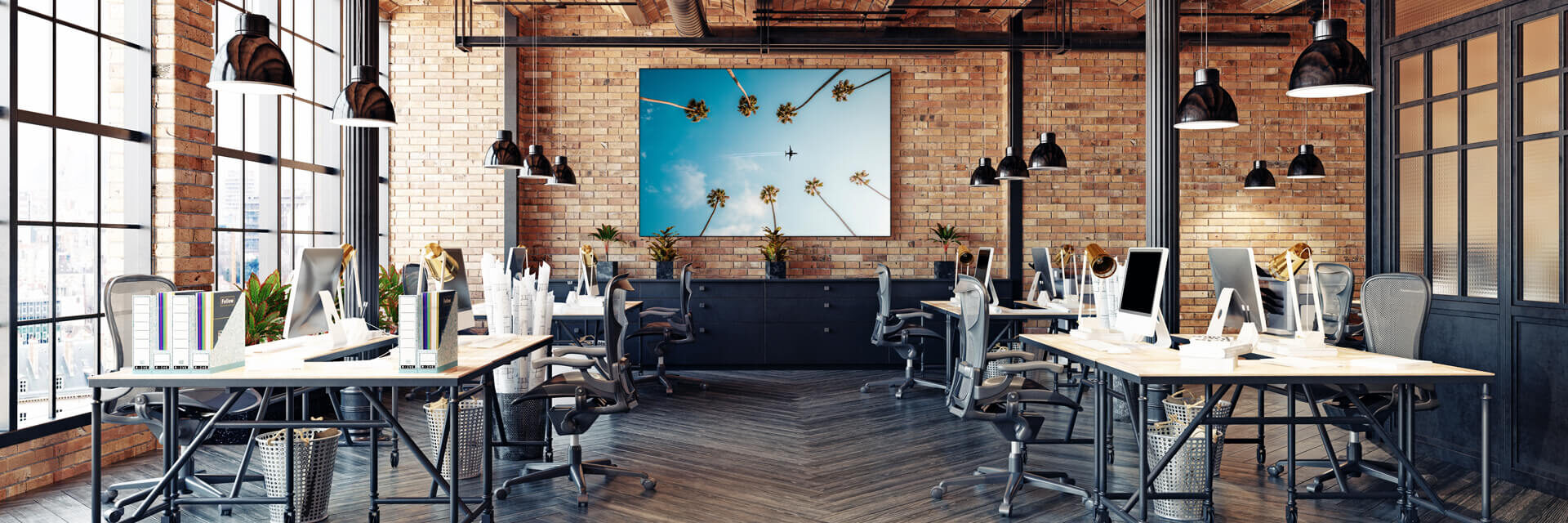 Huge blue office wall art of plane flying between two rows of palm trees hangs on brick wall in modern office.