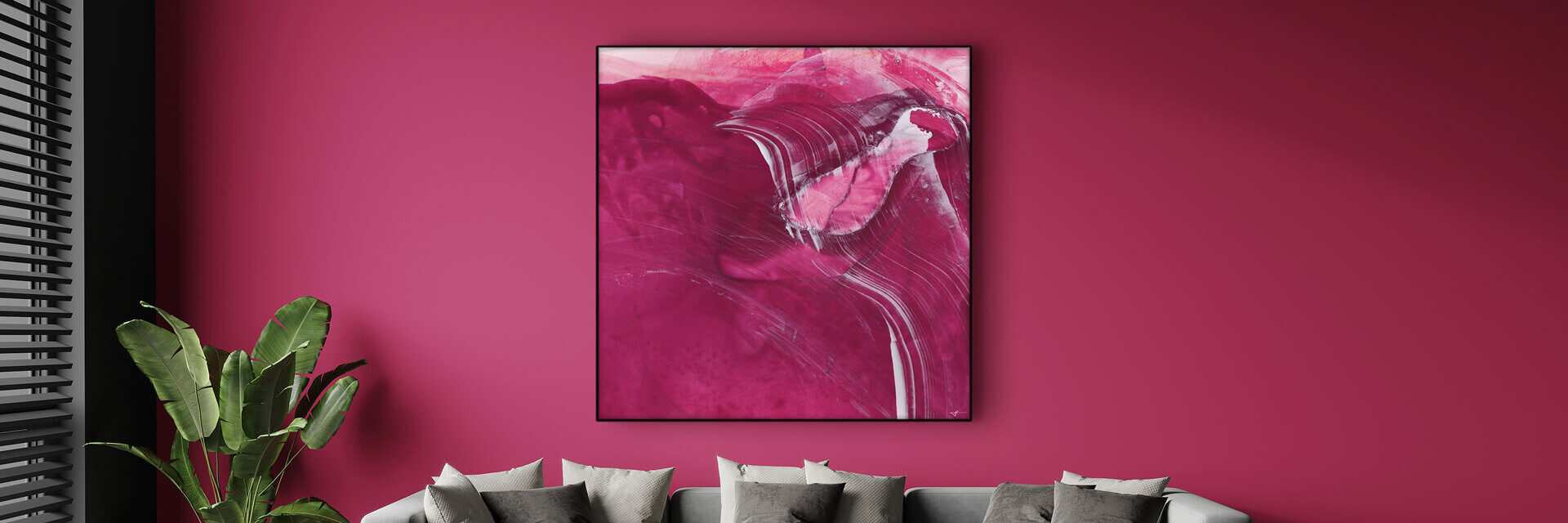 Living room with powerful accent wall in Viva Magenta features abstract magenta painting hanging above light grey couch.