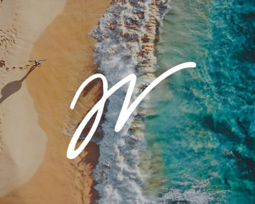 Aerial photo of Hawaii beach coast with Jess Loiterton signature in white