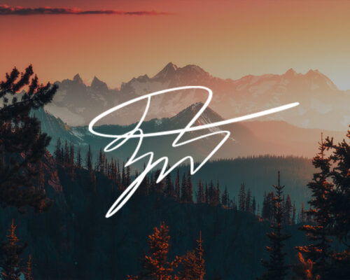 Forest Mountains at Sunset with photographer Zach Doehler's signature in white