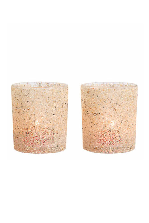 Pair of tea lights with a sandy textured finish, displayed on a white background.