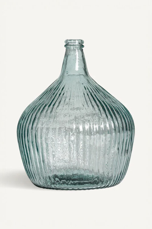 Blue glass vase with vertical ridges, displayed on a white background.