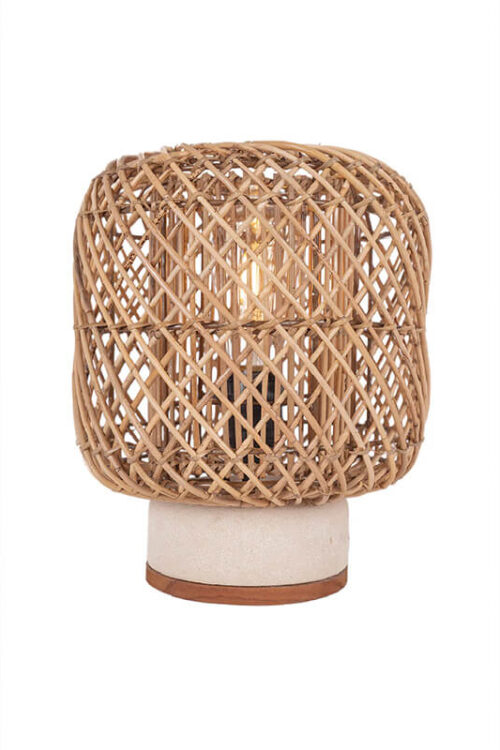 Rattan table lamp with a neutral lampshade on a white background.