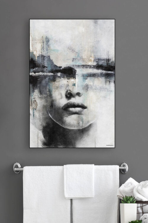 Large abstract face art in neutral grey, black, and blue hangs above towel bar in modern bathroom.