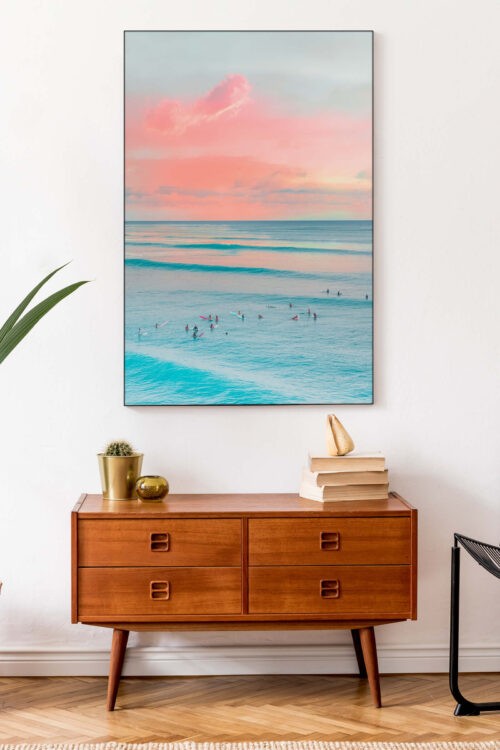 Large Surf landscape in aqua and coral hangs in a minimalistic entryway