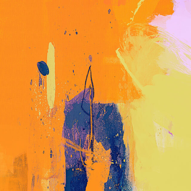 Close up view of yellow blue and orange abstract art. The left half is orange. The right half is yellow. The colors meet in the middle with a patch of dark blue.