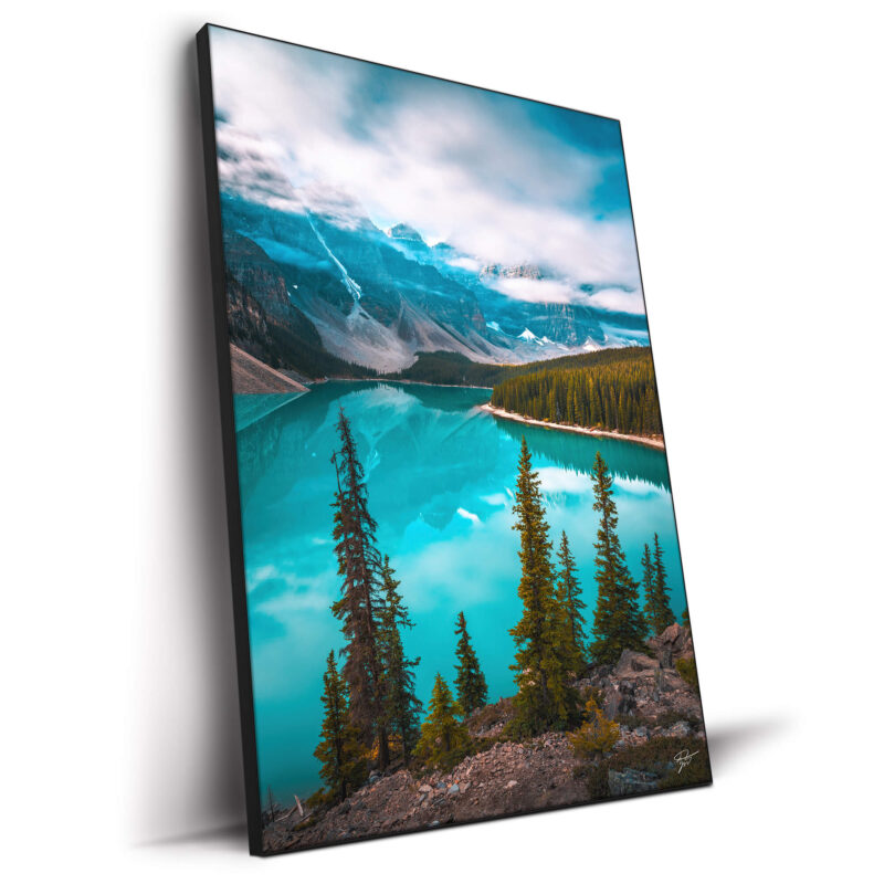 Moraine Lake in Banff National Park, with turquoise waters reflecting peaks and lush pine forests.