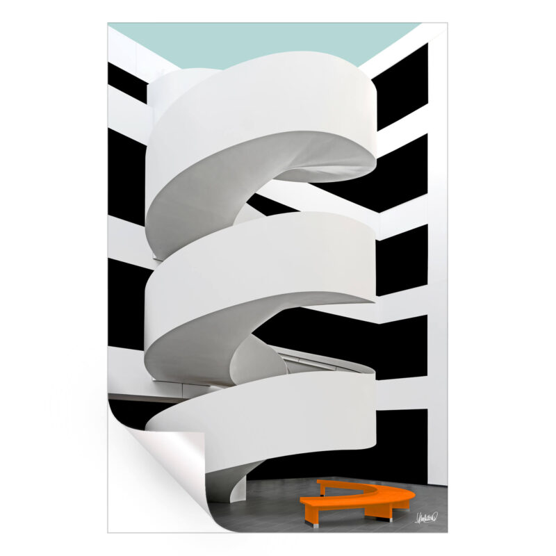 White ramp with black and white background and an orange bench.