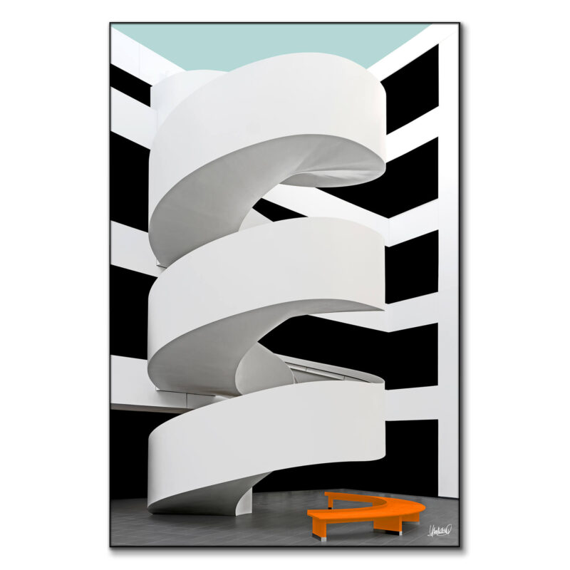 White spiral staircase with black and white background and an orange bench.