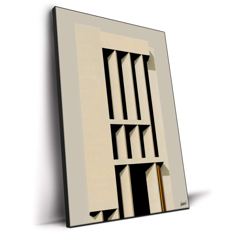 Minimalist facade with clean vertical lines and dramatic shadows in beige.