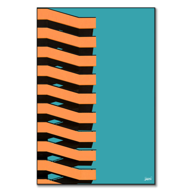 Building with bold orange and black zigzag bands against a teal background.