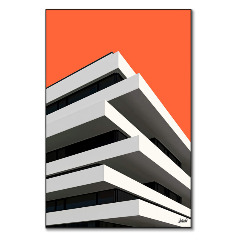 Modern white layered building with a vibrant orange background and minimalist design.