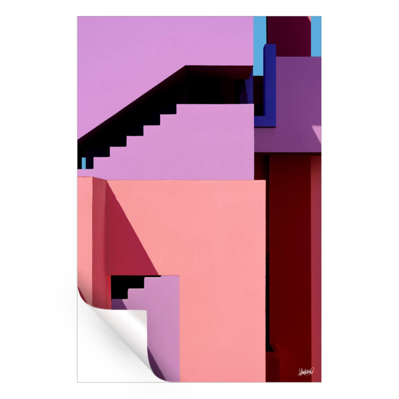 Colorful geometric architecture with pink, purple, and red blocks and shadowed stairs.