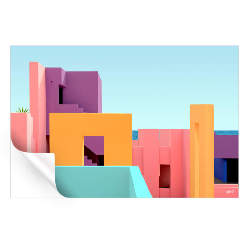 Brightly colored modern architecture with a sea view, featuring orange, pink, and purple structures.