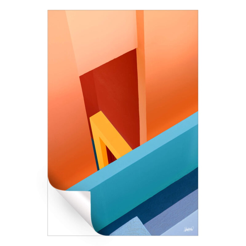 Surreal architecture in vivid orange, yellow, and turquoise, creating an abstract geometric composition.