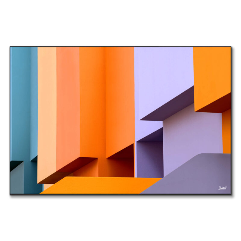 Abstract building with teal, orange, and lavender blocks and geometric forms.
