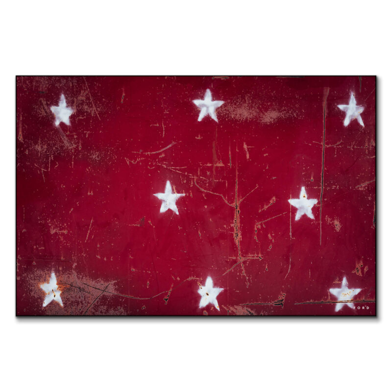 distressed white stars on a bold red background, combining rustic charm with a classic Americana feel.